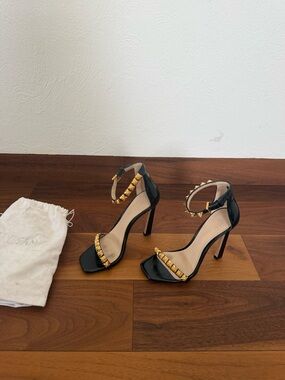 Stuart Weitzman Black Patent Heels with Gold Stud Accents